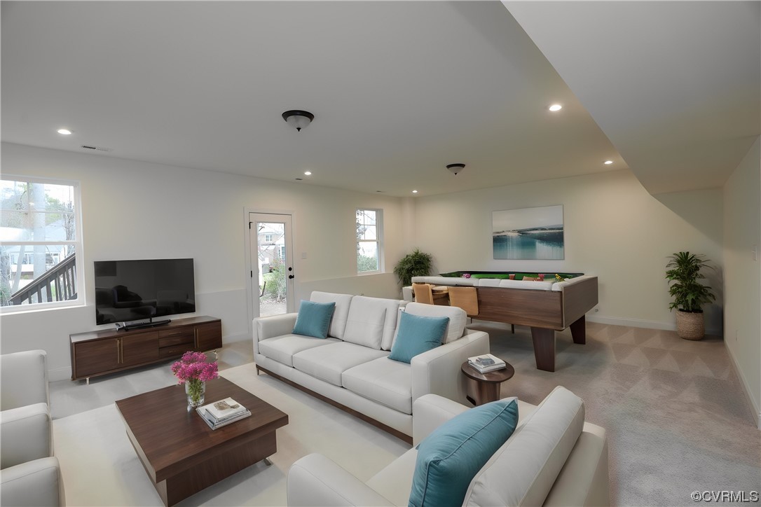 4357 Landfall Drive Williamsburg, VA 23185 - Photo 34 of 44 a living room with furniture and a flat screen tv
