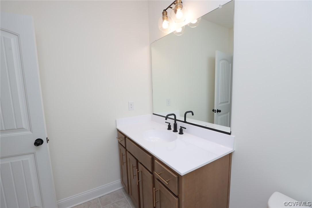 4357 Landfall Drive Williamsburg, VA 23185 - Photo 37 of 44 a bathroom with a sink and a mirror