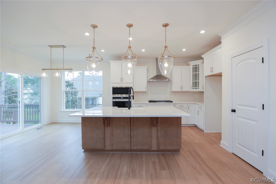 4357 Landfall Drive Williamsburg, VA 23185 - Photo 8 of 44 a large kitchen with stainless steel appliances kitchen island a large island in the center