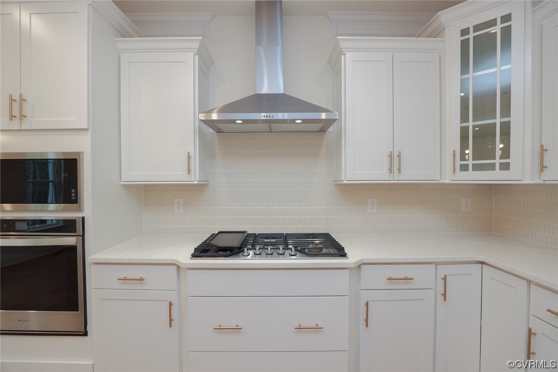 4357 Landfall Drive Williamsburg, VA 23185 - Photo 10 of 44 a kitchen with granite countertop white cabinets and stainless steel appliances