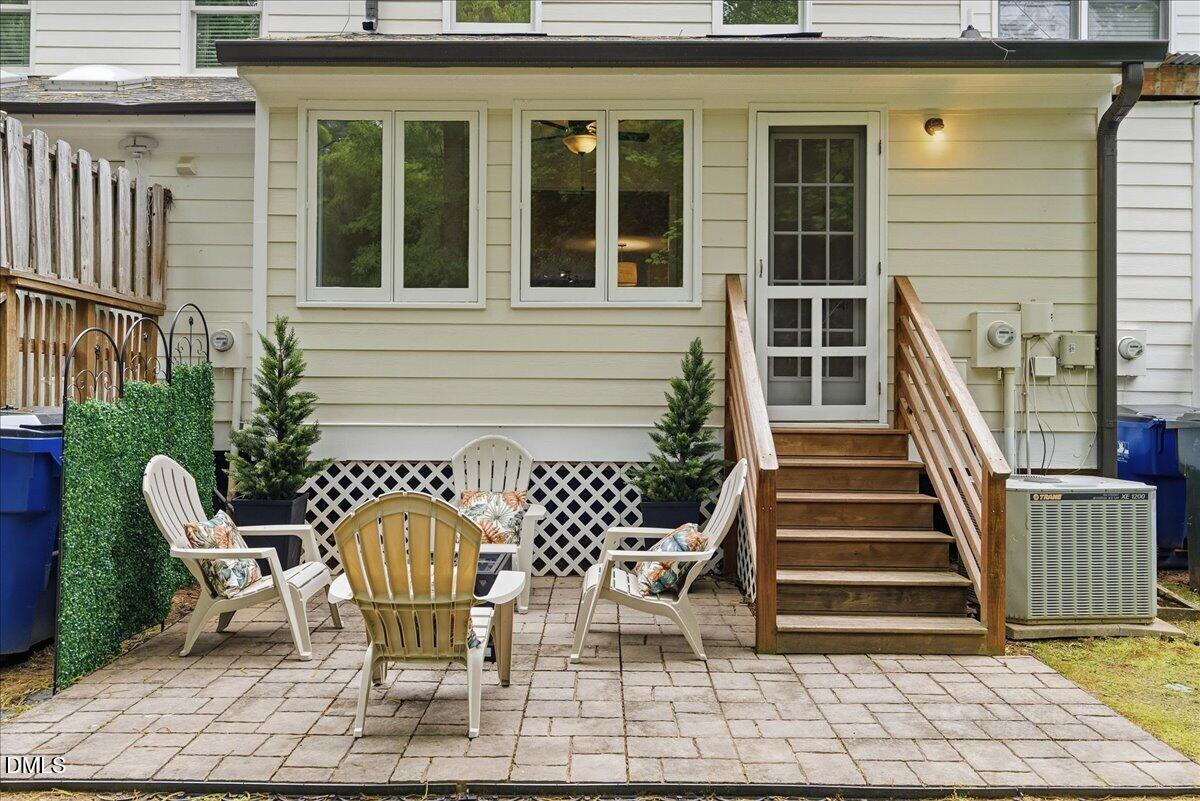 2834 Wayland Drive Raleigh, NC 27608 - Photo 20 of 26 a two chairs sitting in front of a house