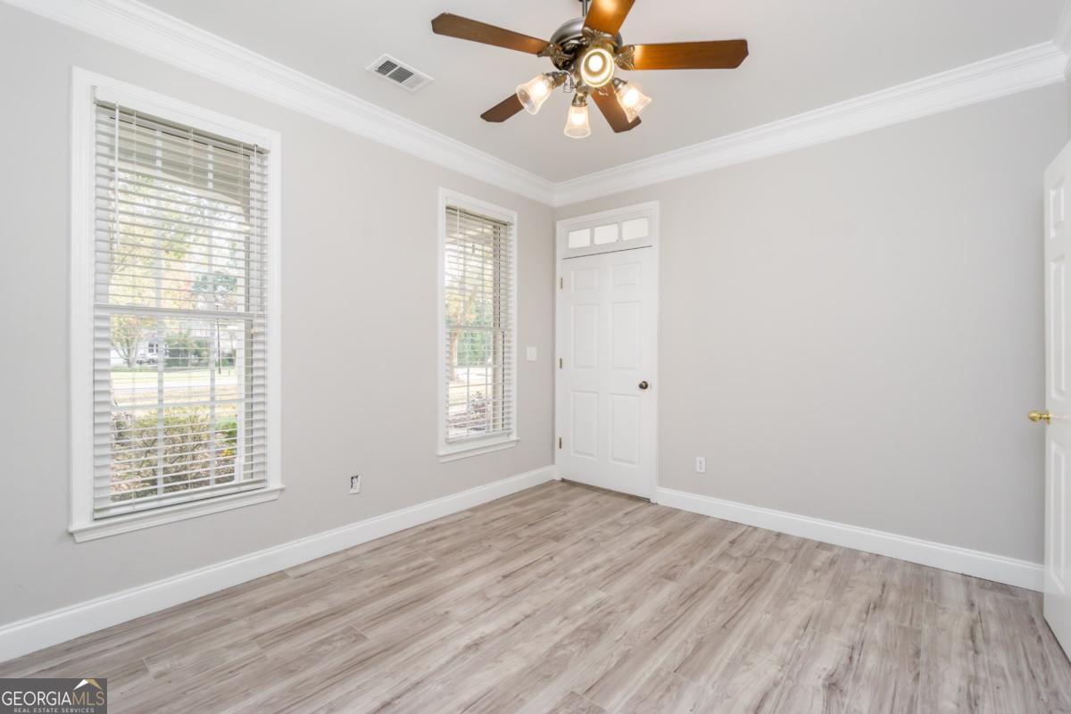 6710 Timber Cove Pointe Cumming, GA 30041 - Photo 12 of 51 wooden floor in an empty room with a window