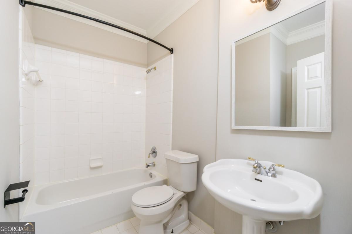 6710 Timber Cove Pointe Cumming, GA 30041 - Photo 16 of 51 a bathroom with a sink toilet and shower