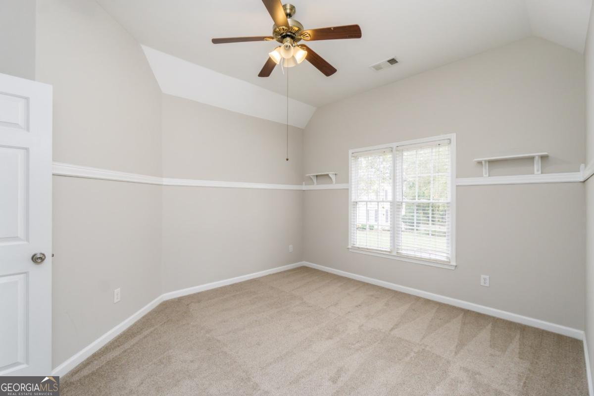 6710 Timber Cove Pointe Cumming, GA 30041 - Photo 30 of 51 an empty room with windows and fan