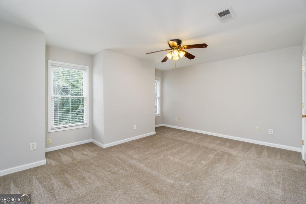 6710 Timber Cove Pointe Cumming, GA 30041 - Photo 35 of 51 a view of room with a ceiling fan and window