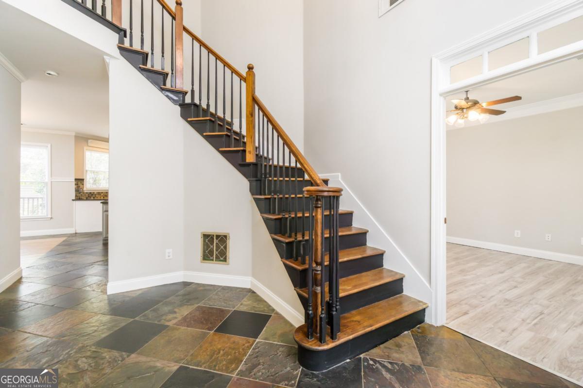6710 Timber Cove Pointe Cumming, GA 30041 - Photo 4 of 51 a view of entryway and hall with wooden floor