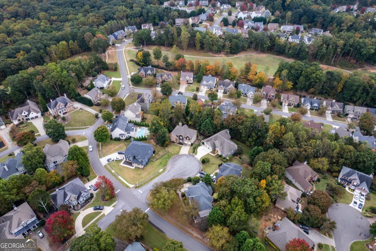 6710 Timber Cove Pointe Cumming, GA 30041 - Photo 43 of 51 an aerial view of lake residential houses with outdoor space and swimming pool