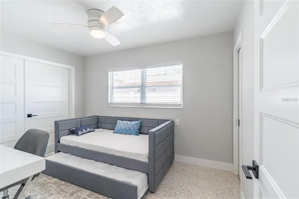 a bedroom with a bed and window