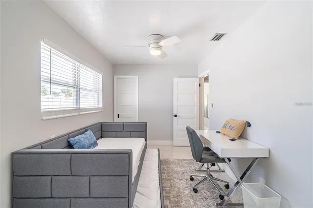 a living room with furniture and a window