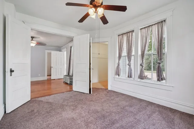 a white toilet sitting next to a bathroom sink