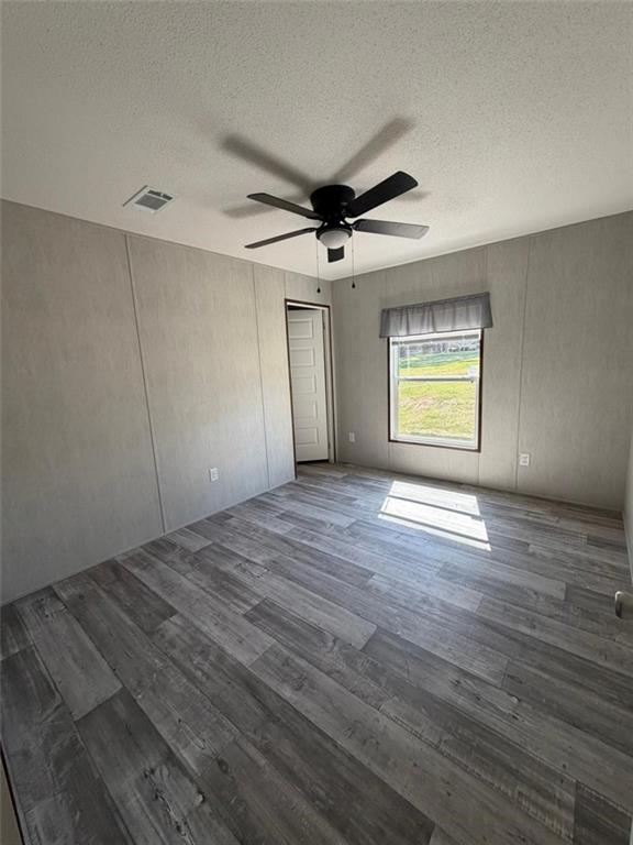 2606 Whipporwill Road Royston, GA 30662 - Photo 10 of 30 wooden floor in an empty room with a window