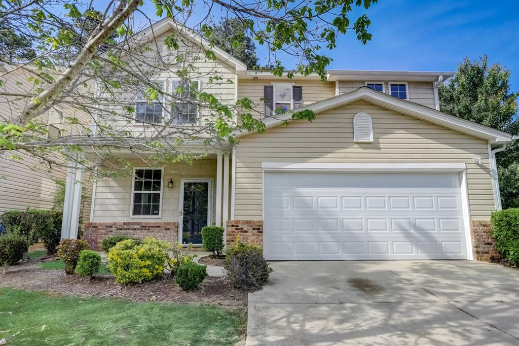 3187 Sable Run Road Atlanta, GA 30349 - Photo 1 of 1 a front view of a house with garden