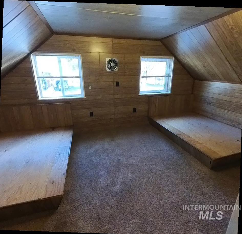 418 13th Street Clarkston, WA 99403 - Photo 7 of 26 Bonus room featuring carpet flooring, lofted ceiling, and wood walls
