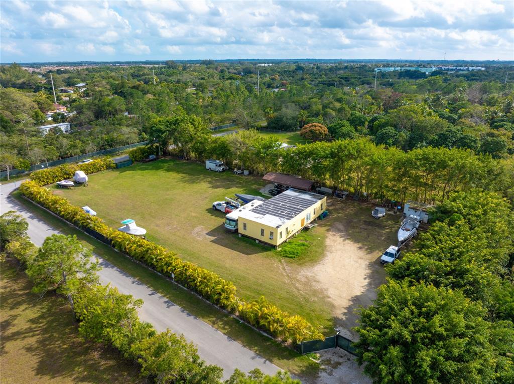 23600 Southwest 125th Avenue Homestead, FL 33032 - Photo 11 of 18 an aerial view of residential houses with outdoor space