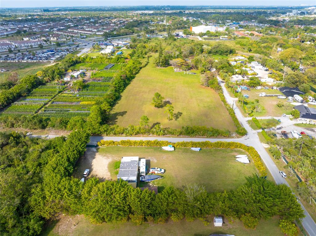 23600 Southwest 125th Avenue Homestead, FL 33032 - Photo 8 of 18 an aerial view of residential houses with outdoor space