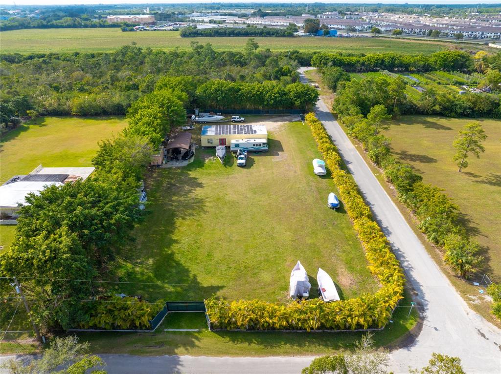 23600 Southwest 125th Avenue Homestead, FL 33032 - Photo 10 of 18 a view of a swimming pool and lake view
