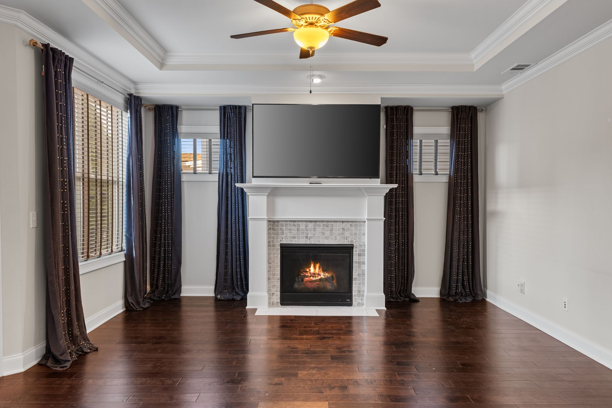 5102 Donovan Street Franklin, TN 37064 - Photo 11 of 45 a living room with wooden floor and a fireplace