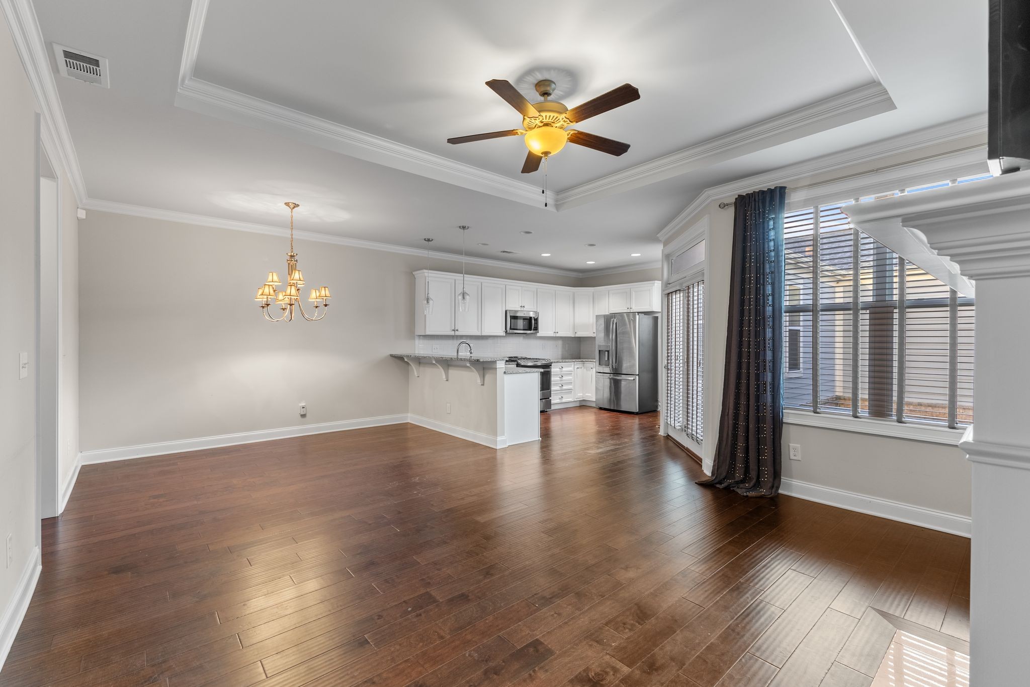 5102 Donovan Street Franklin, TN 37064 - Photo 13 of 45 a view of an empty room with wooden floor and a window