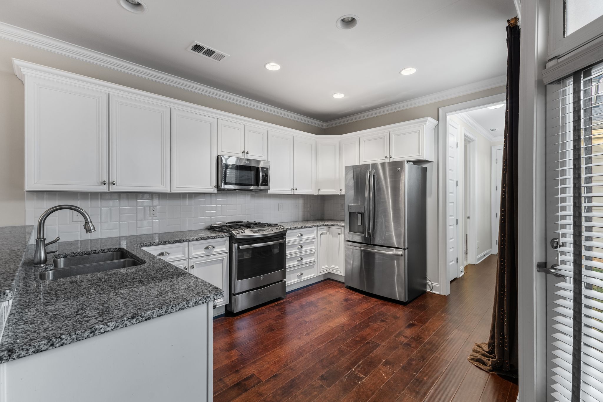 5102 Donovan Street Franklin, TN 37064 - Photo 15 of 45 a kitchen with a refrigerator sink and stainless steel appliances