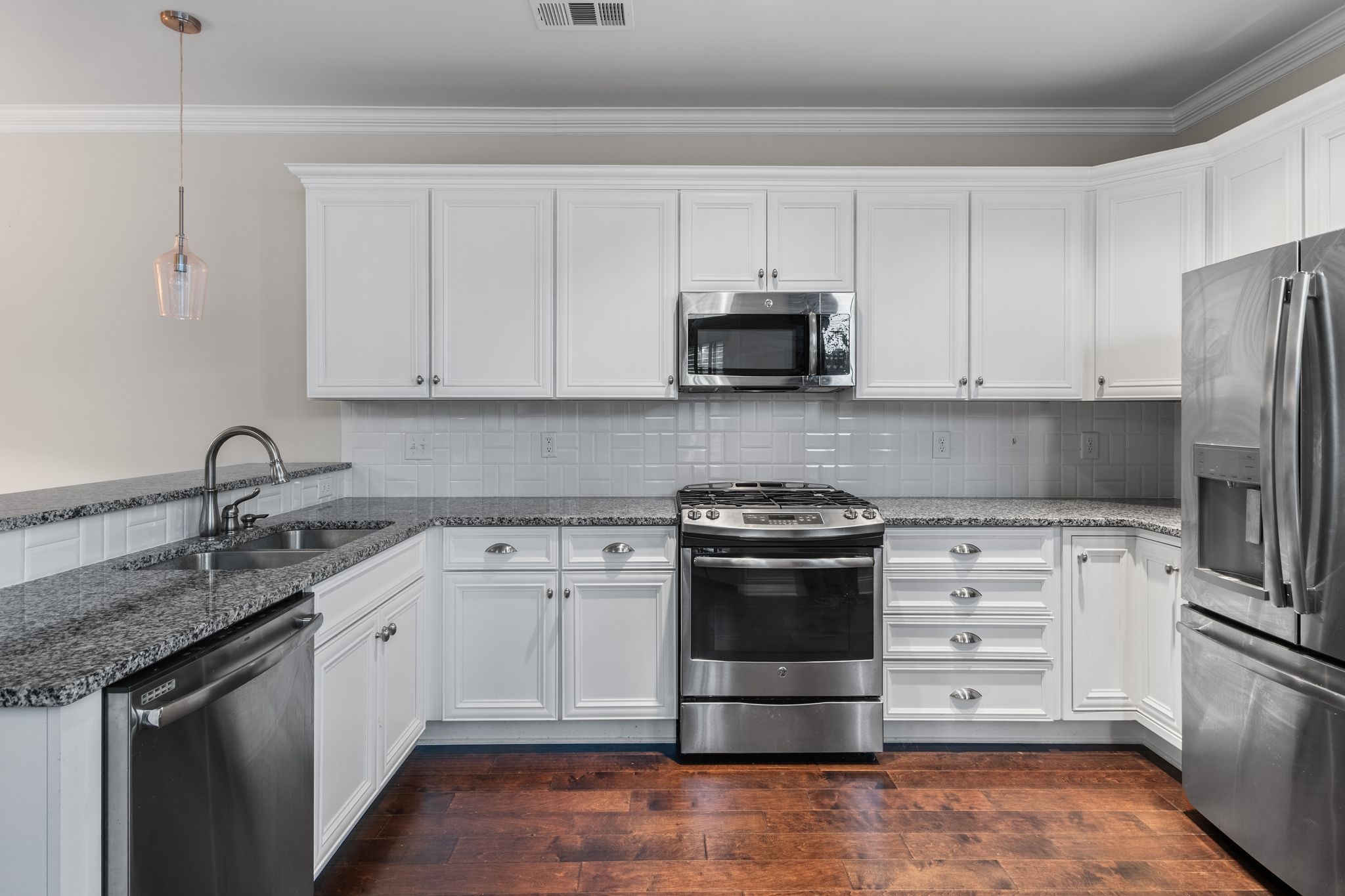 5102 Donovan Street Franklin, TN 37064 - Photo 16 of 45 a kitchen with appliances a sink and cabinets