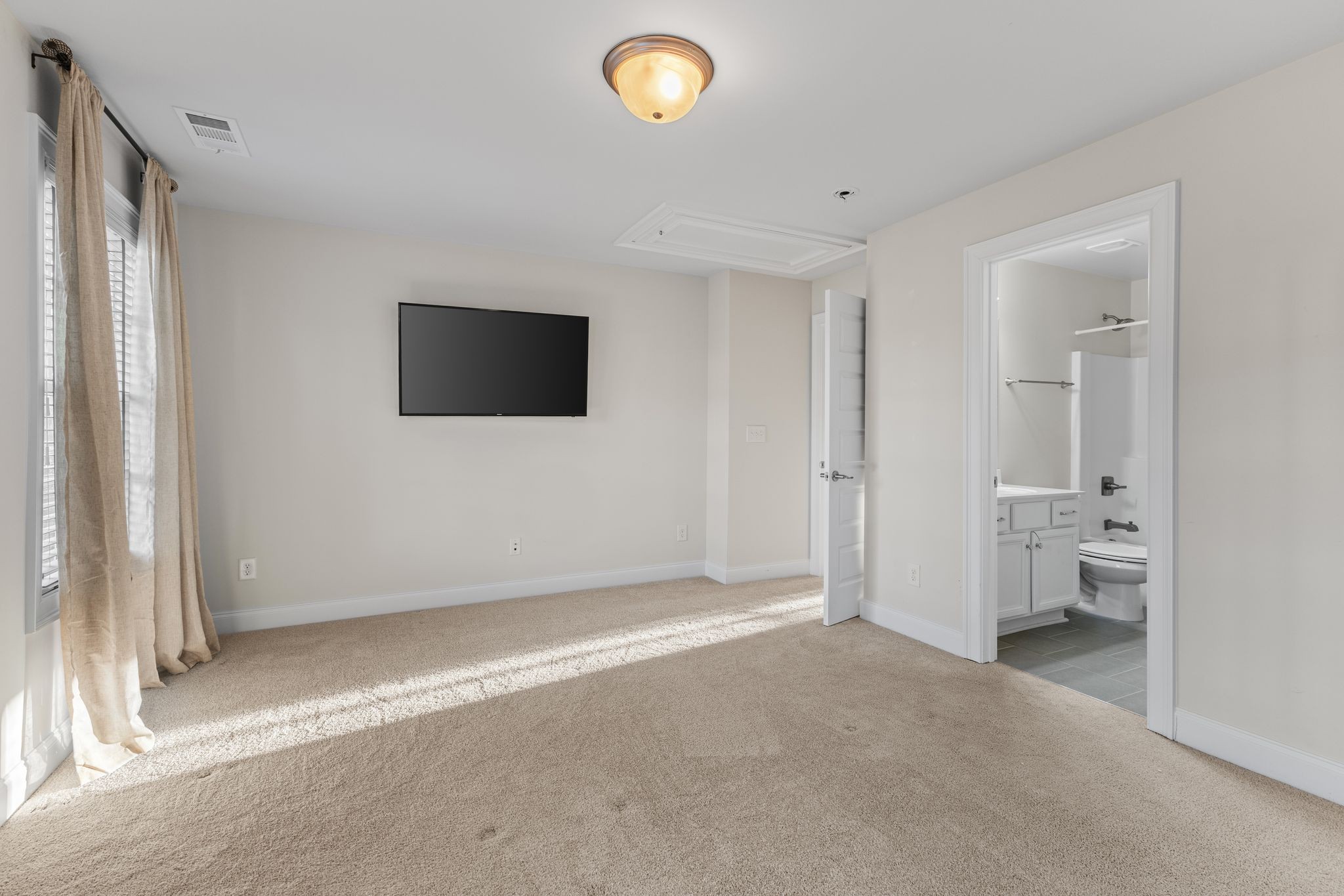 5102 Donovan Street Franklin, TN 37064 - Photo 31 of 45 an empty room with a flat screen tv and a window