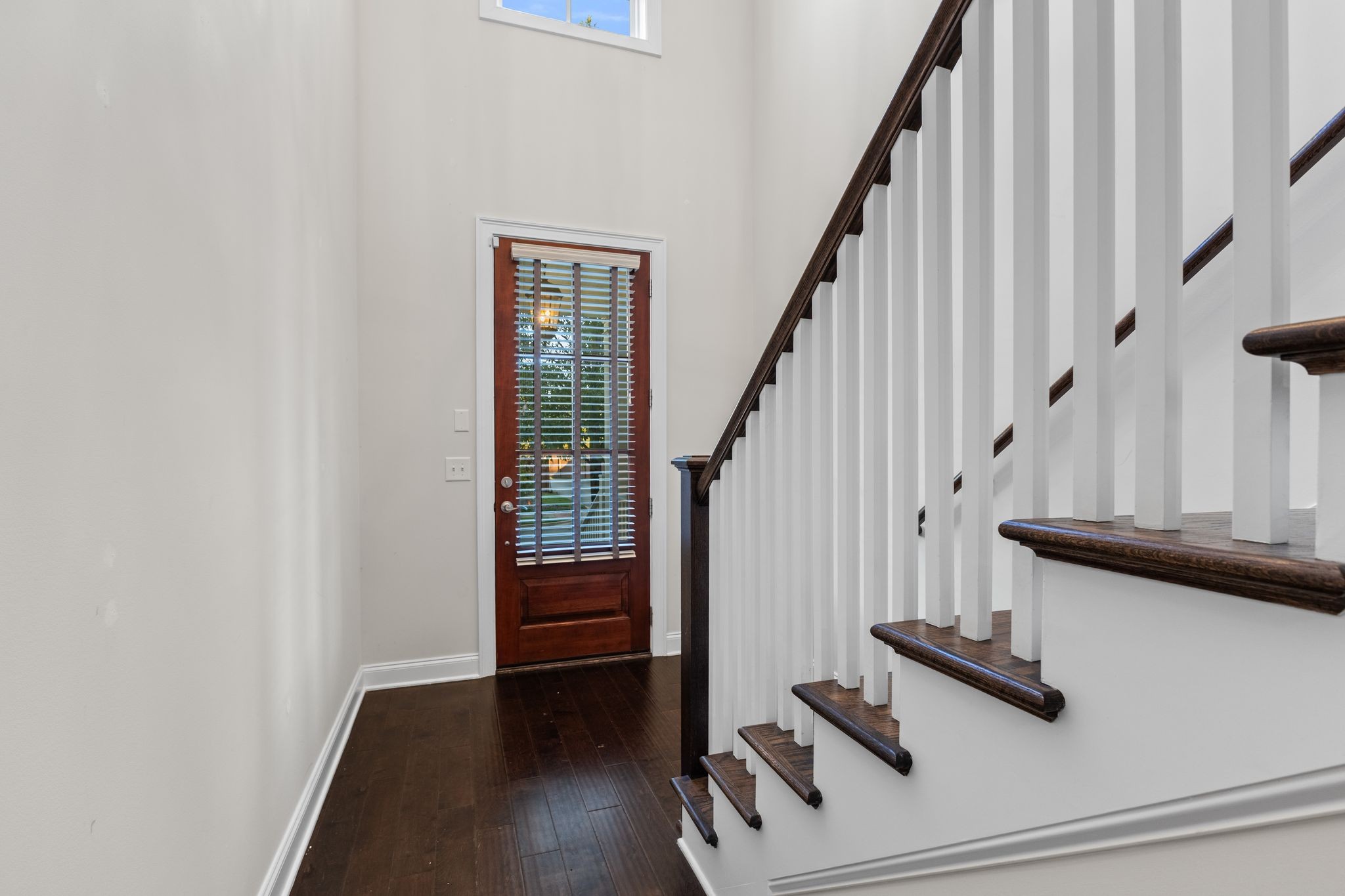 5102 Donovan Street Franklin, TN 37064 - Photo 9 of 45 a view of entryway with wooden floor and stairs