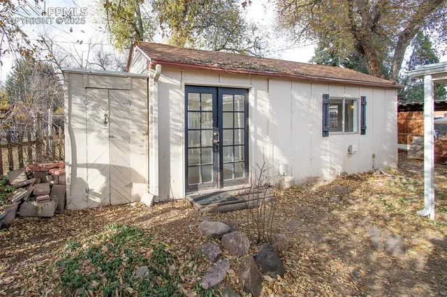 a bedroom with bed and window