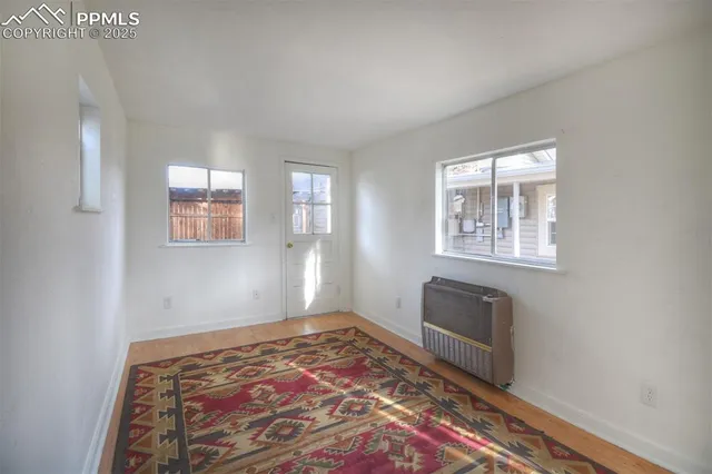 a view of an empty room and window