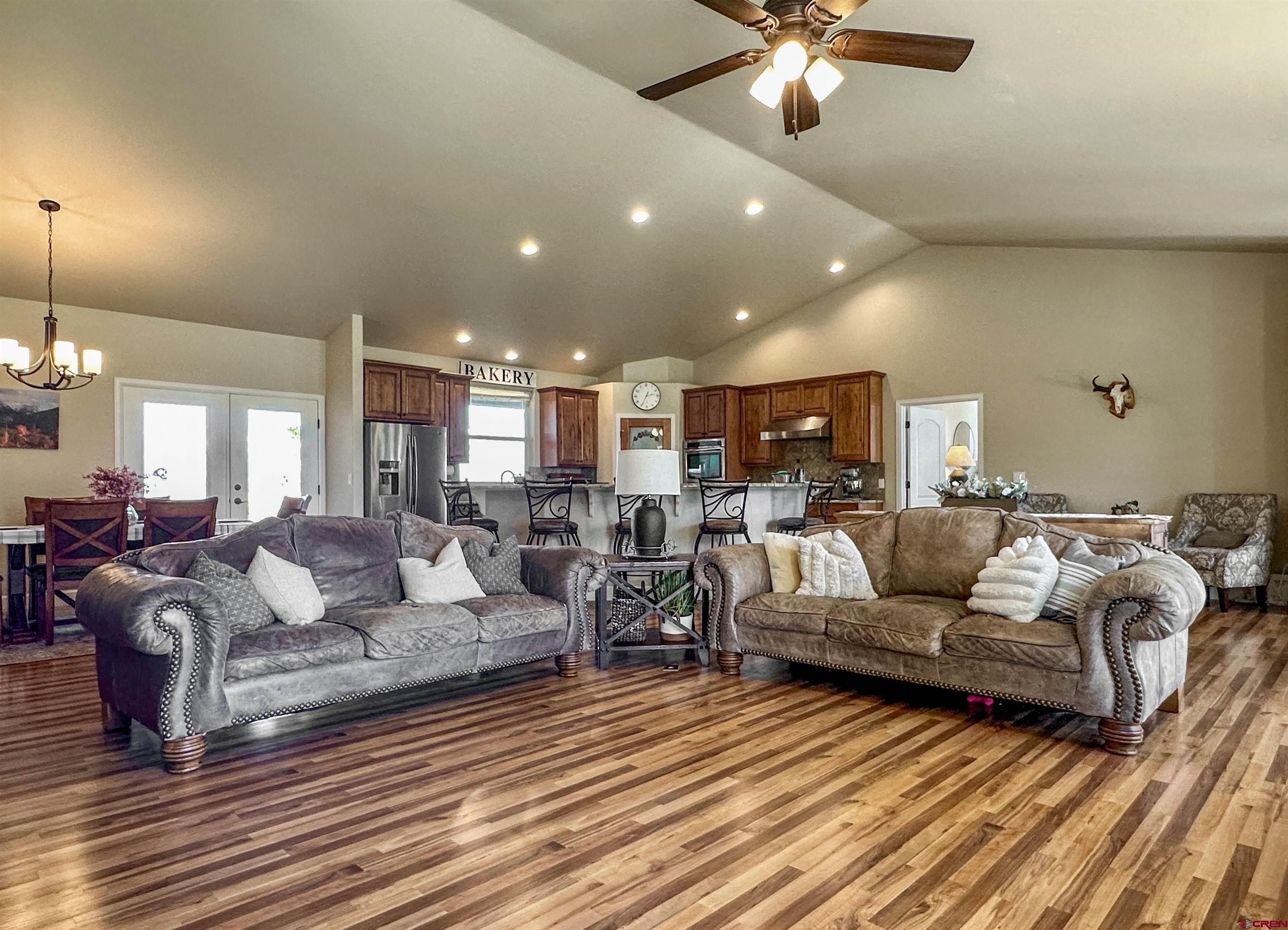 424 Shilo Court Delta, CO 81416 - Photo 11 of 45 a living room with furniture and a chandelier