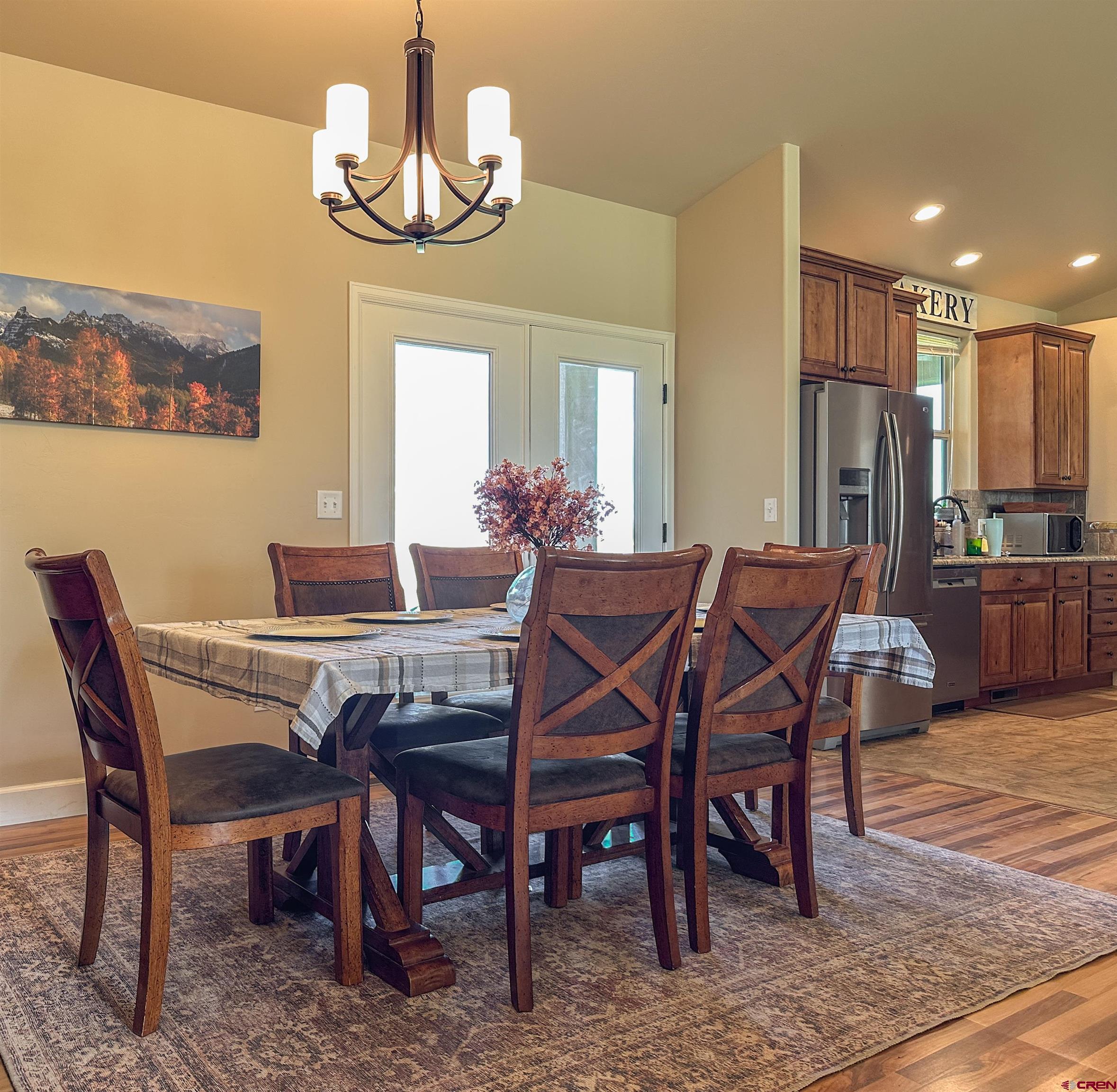 424 Shilo Court Delta, CO 81416 - Photo 13 of 45 a view of a dining room with furniture wooden floor and a chandelier