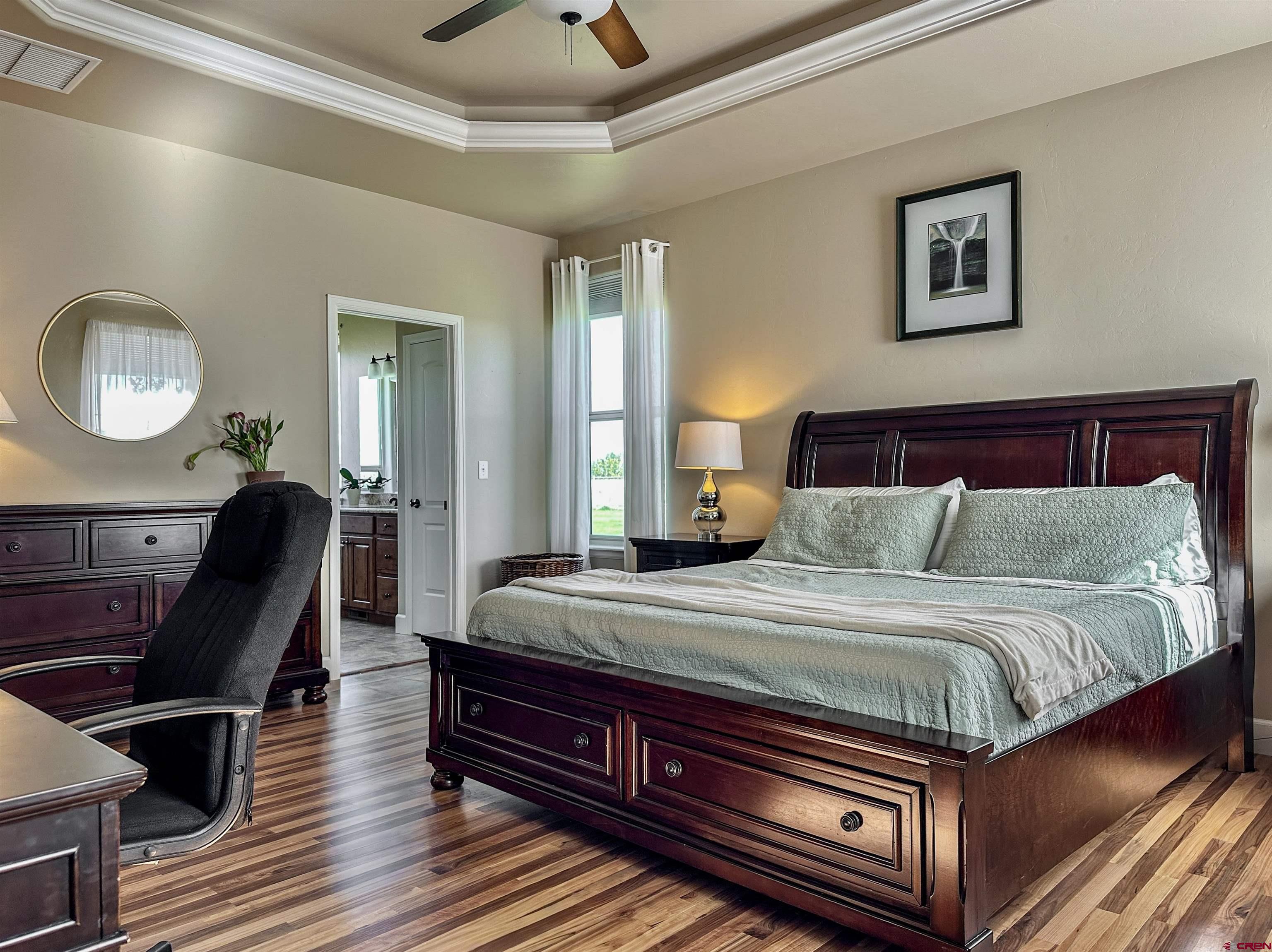 424 Shilo Court Delta, CO 81416 - Photo 19 of 45 a bed room with a bed and a chair