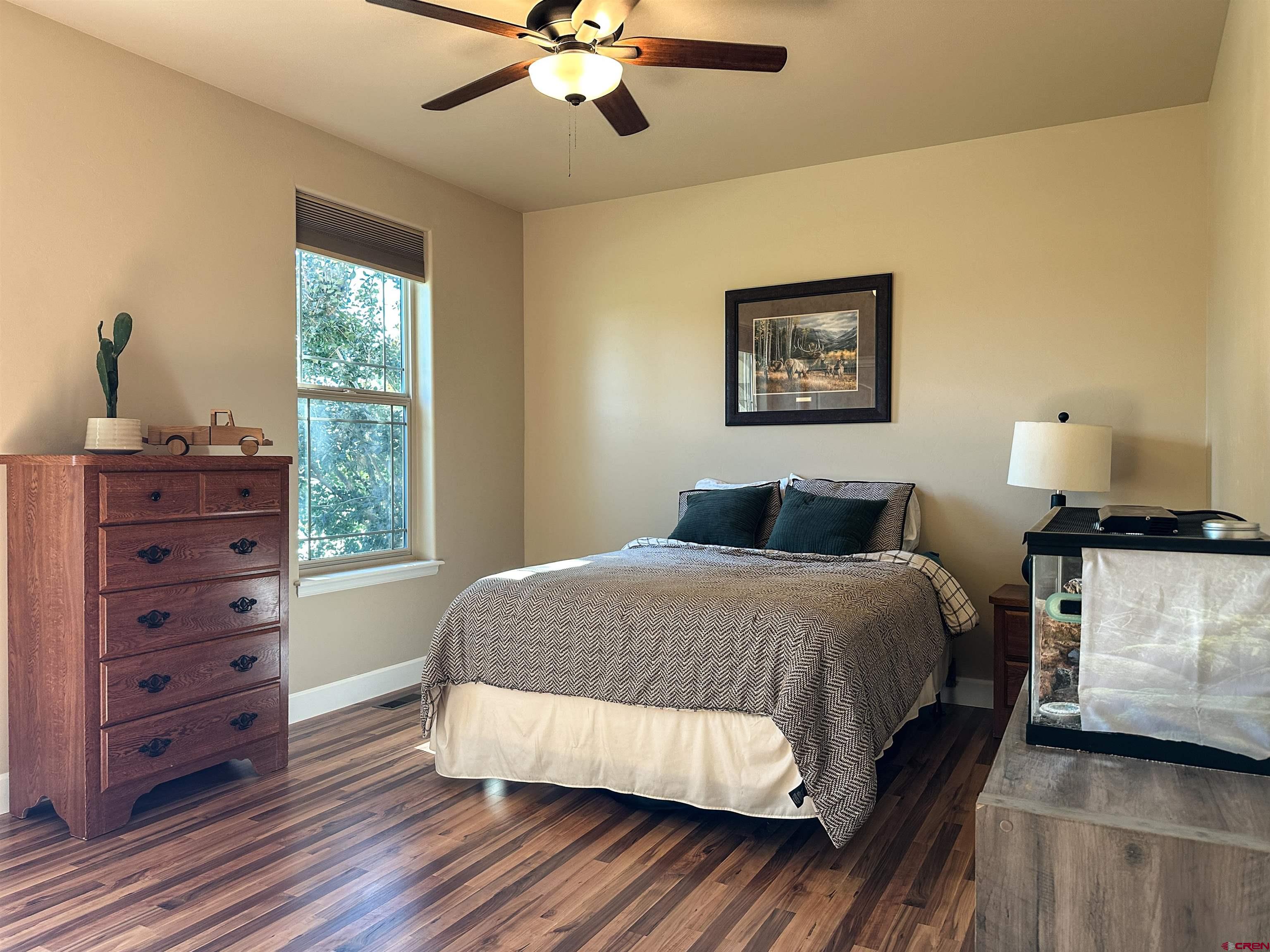 424 Shilo Court Delta, CO 81416 - Photo 26 of 45 a bedroom with a bed and a window