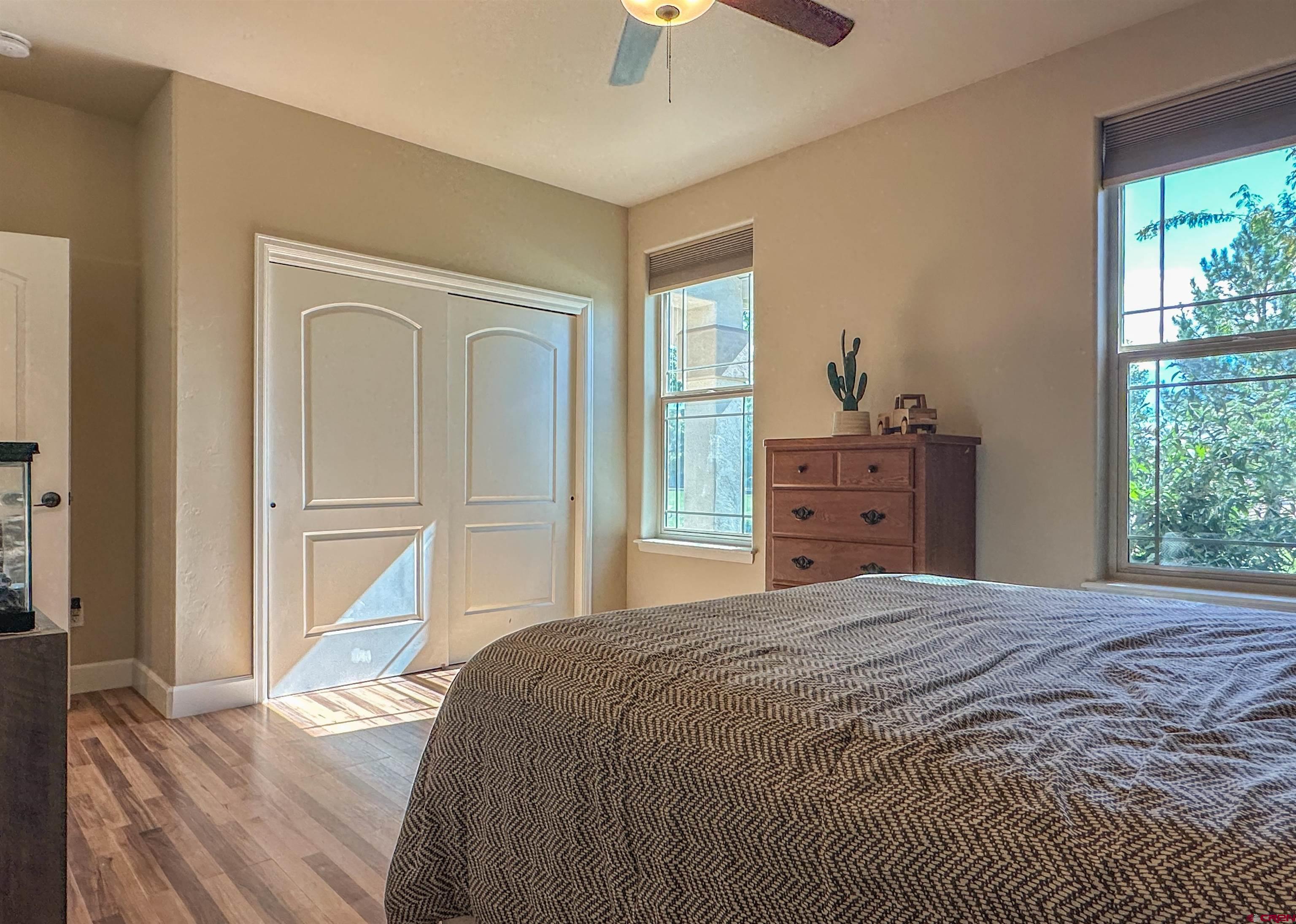 424 Shilo Court Delta, CO 81416 - Photo 27 of 45 a bedroom with a bed and a window