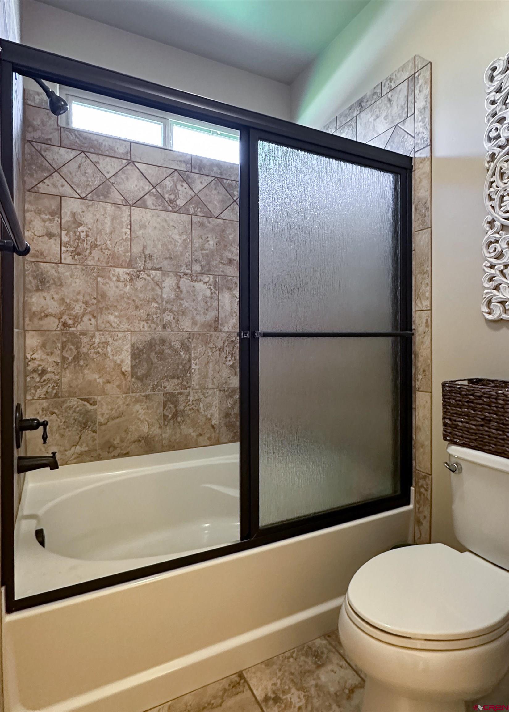 424 Shilo Court Delta, CO 81416 - Photo 29 of 45 a bathroom with a toilet and a shower