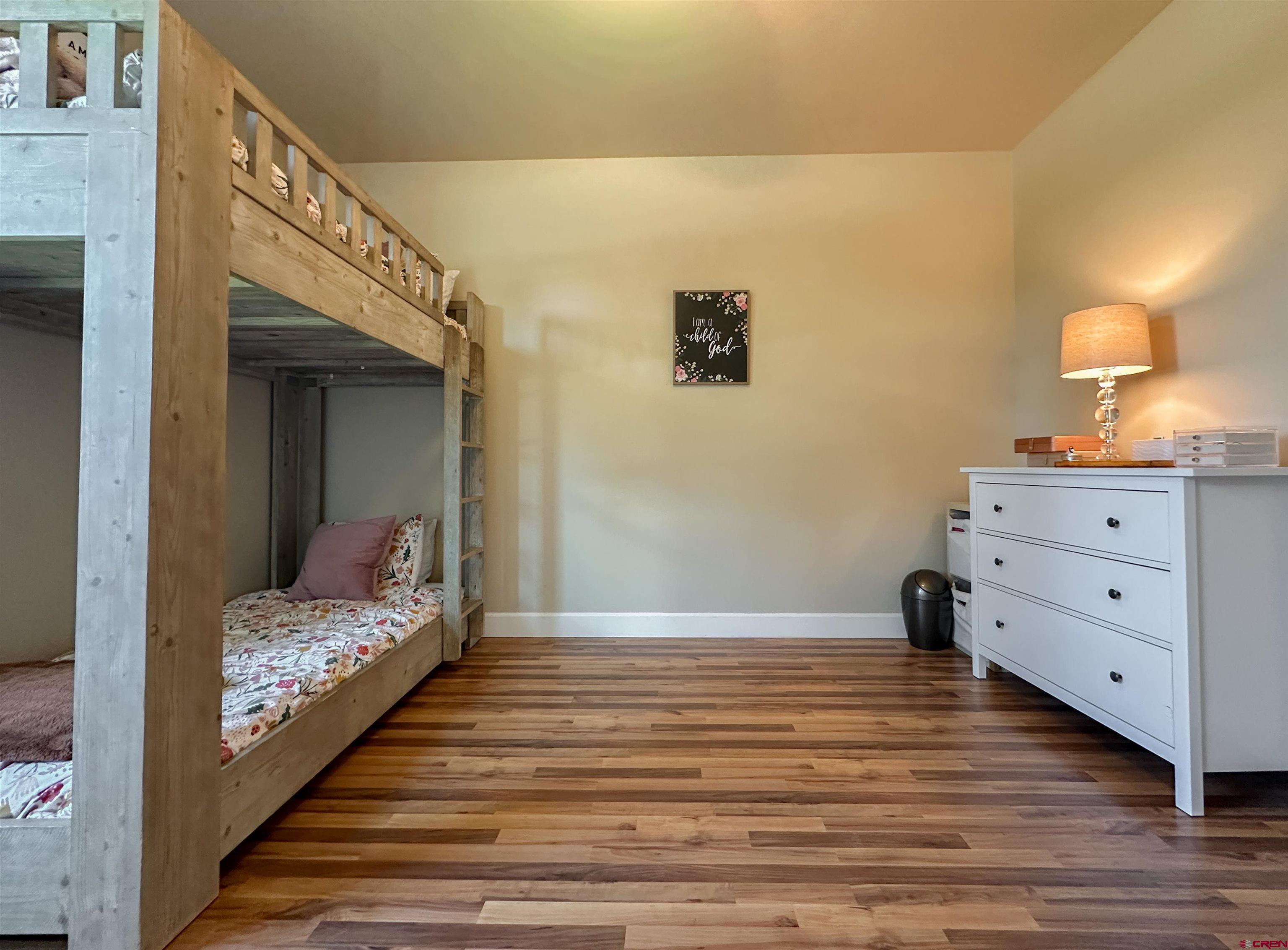 424 Shilo Court Delta, CO 81416 - Photo 30 of 45 a bedroom with a bed and a dresser