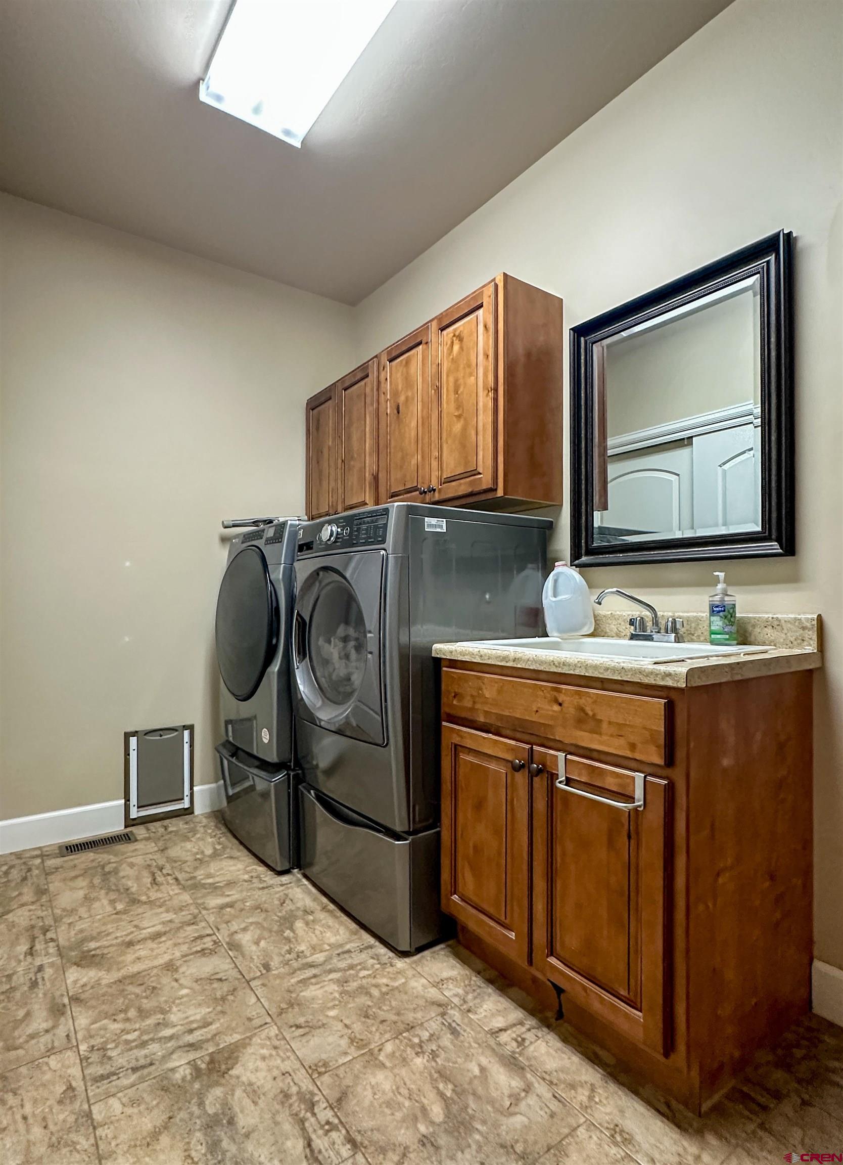 424 Shilo Court Delta, CO 81416 - Photo 32 of 45 a kitchen with stainless steel appliances granite countertop a sink and cabinets