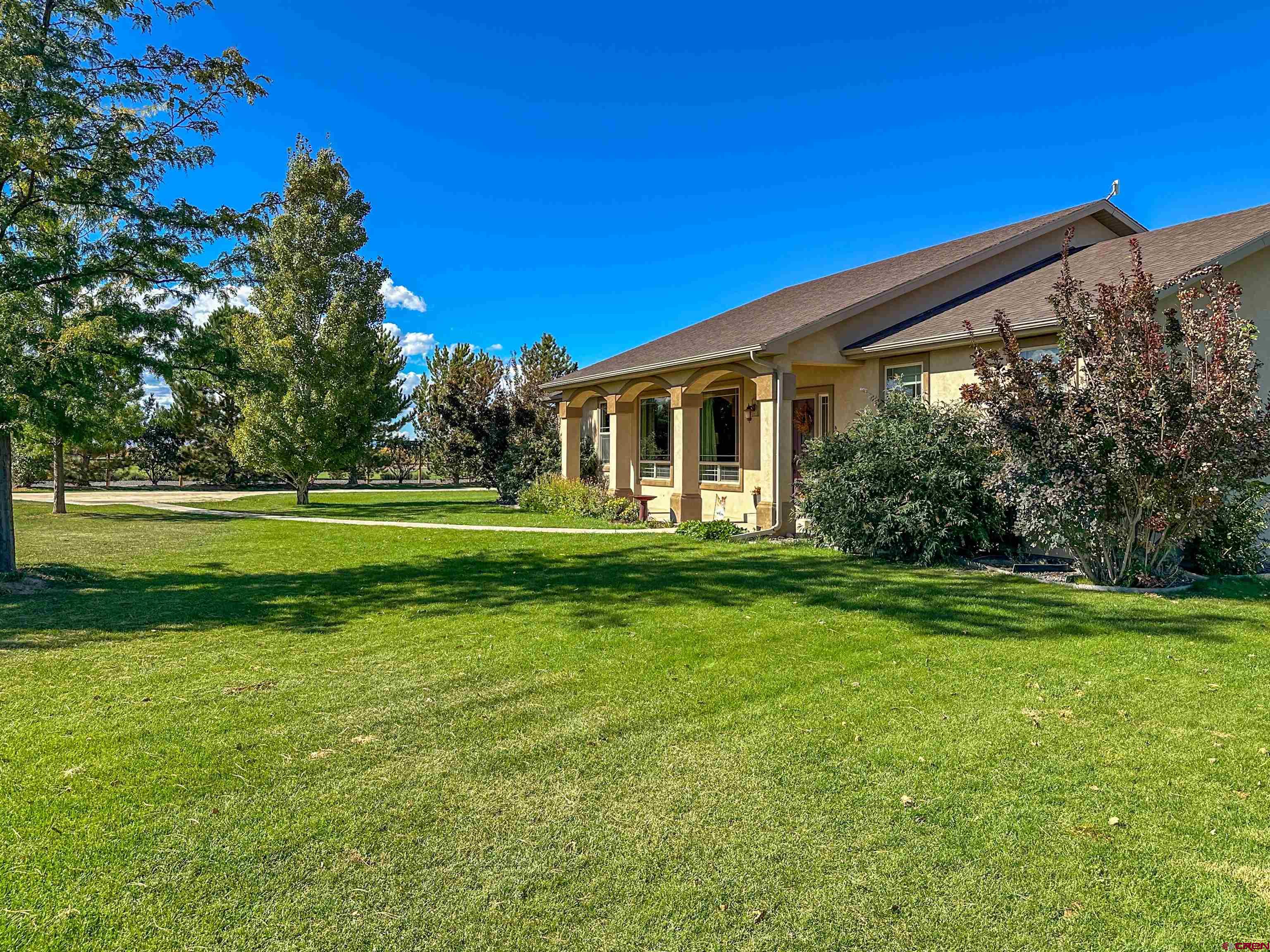 424 Shilo Court Delta, CO 81416 - Photo 40 of 45 a front view of a house with a yard