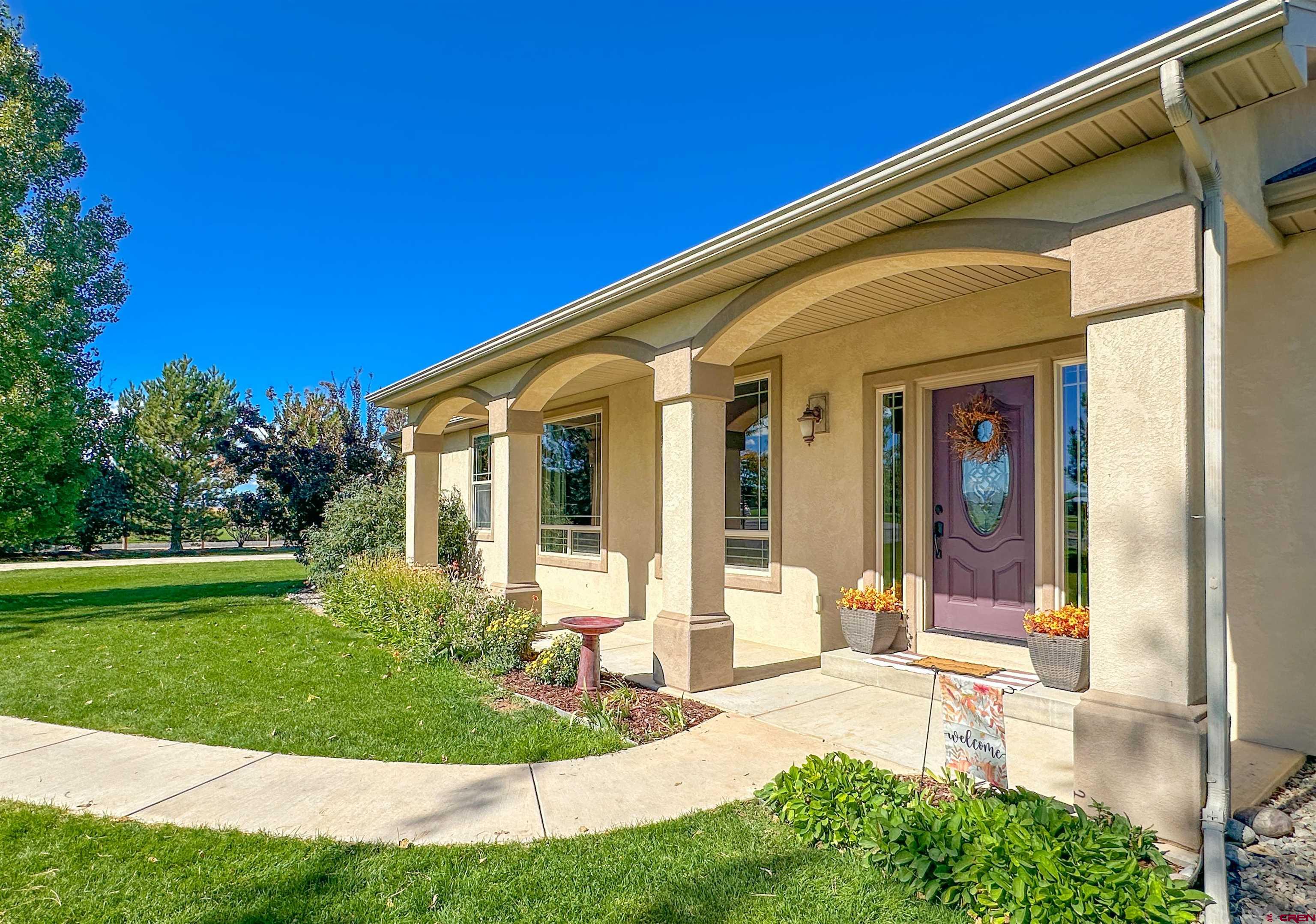 424 Shilo Court Delta, CO 81416 - Photo 4 of 45 a view of a house with backyard and porch