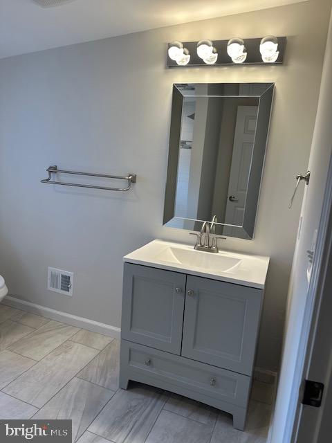1004 South Cameron Street Winchester, VA 22601 - Photo 12 of 26 a bathroom with a sink vanity and mirror