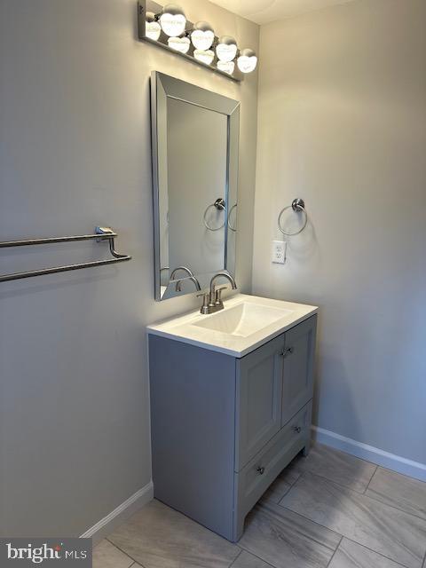 1004 South Cameron Street Winchester, VA 22601 - Photo 13 of 26 a bathroom with a sink vanity and mirror