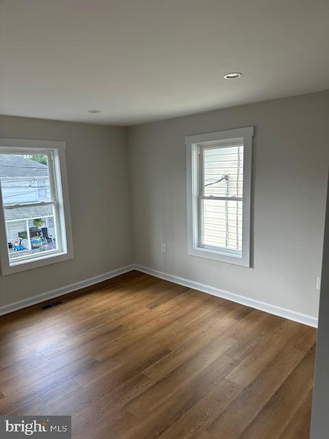 1004 South Cameron Street Winchester, VA 22601 - Photo 15 of 26 an empty room with wooden floor and windows