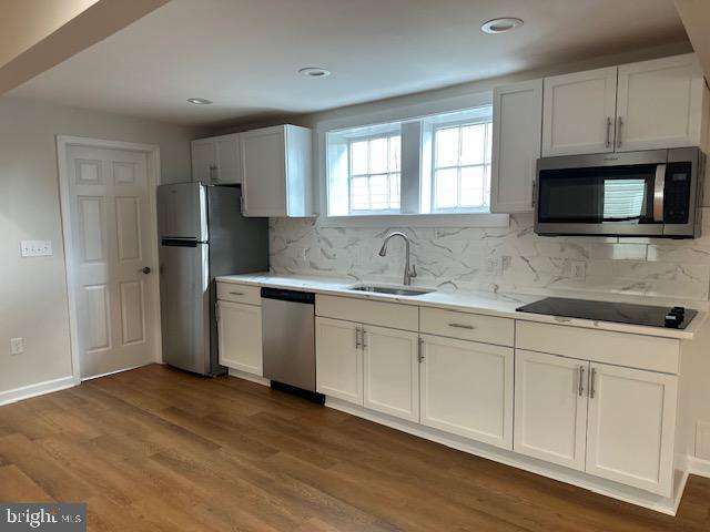 1004 South Cameron Street Winchester, VA 22601 - Photo 21 of 26 a kitchen with stainless steel appliances granite countertop a sink a stove a refrigerator and white cabinets