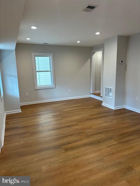 1004 South Cameron Street Winchester, VA 22601 - Photo 22 of 26 an empty room with wooden floor and windows
