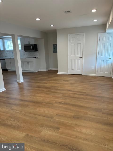 1004 South Cameron Street Winchester, VA 22601 - Photo 24 of 26 an empty room with wooden floor and windows