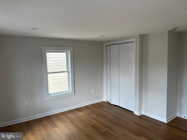 1004 South Cameron Street Winchester, VA 22601 - Photo 3 of 26 an empty room with wooden floor and windows