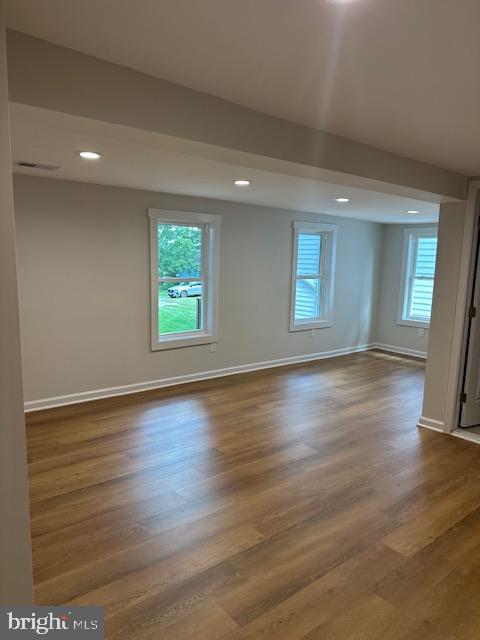 1004 South Cameron Street Winchester, VA 22601 - Photo 8 of 26 an empty room with wooden floor and windows