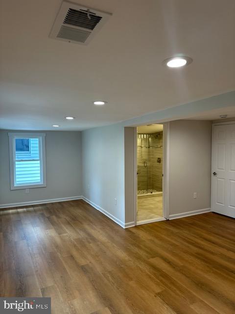 1004 South Cameron Street Winchester, VA 22601 - Photo 9 of 26 an empty room with wooden floor and windows