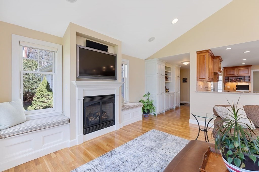 15 Gould Road Newton, MA 02468 - Photo 13 of 33 a living room with furniture a flat screen tv and a fireplace