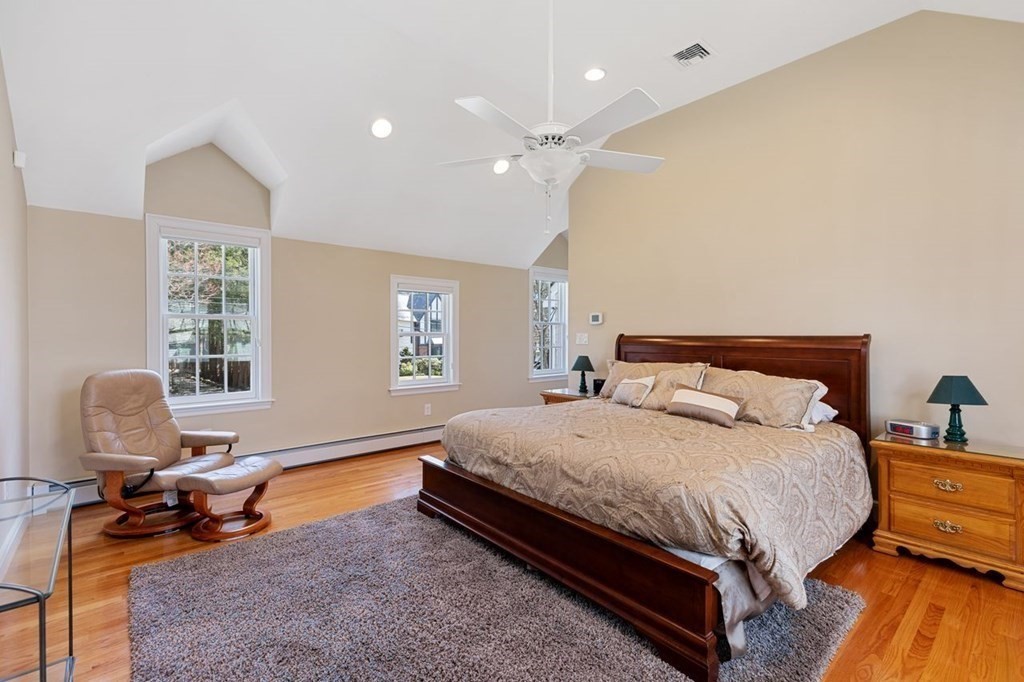 15 Gould Road Newton, MA 02468 - Photo 18 of 33 a bedroom with a bed a table and chair