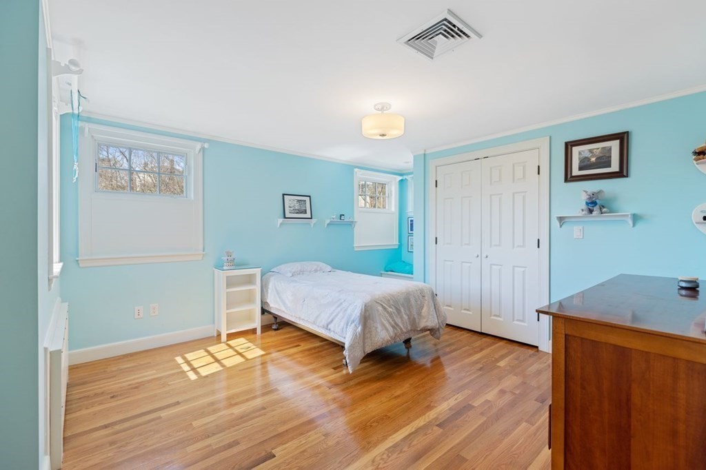 15 Gould Road Newton, MA 02468 - Photo 20 of 33 a bedroom with a bed and a table